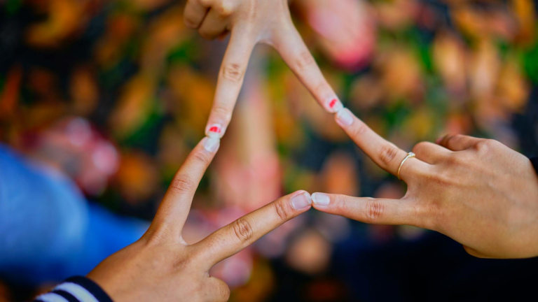 photography of people connecting their fingers